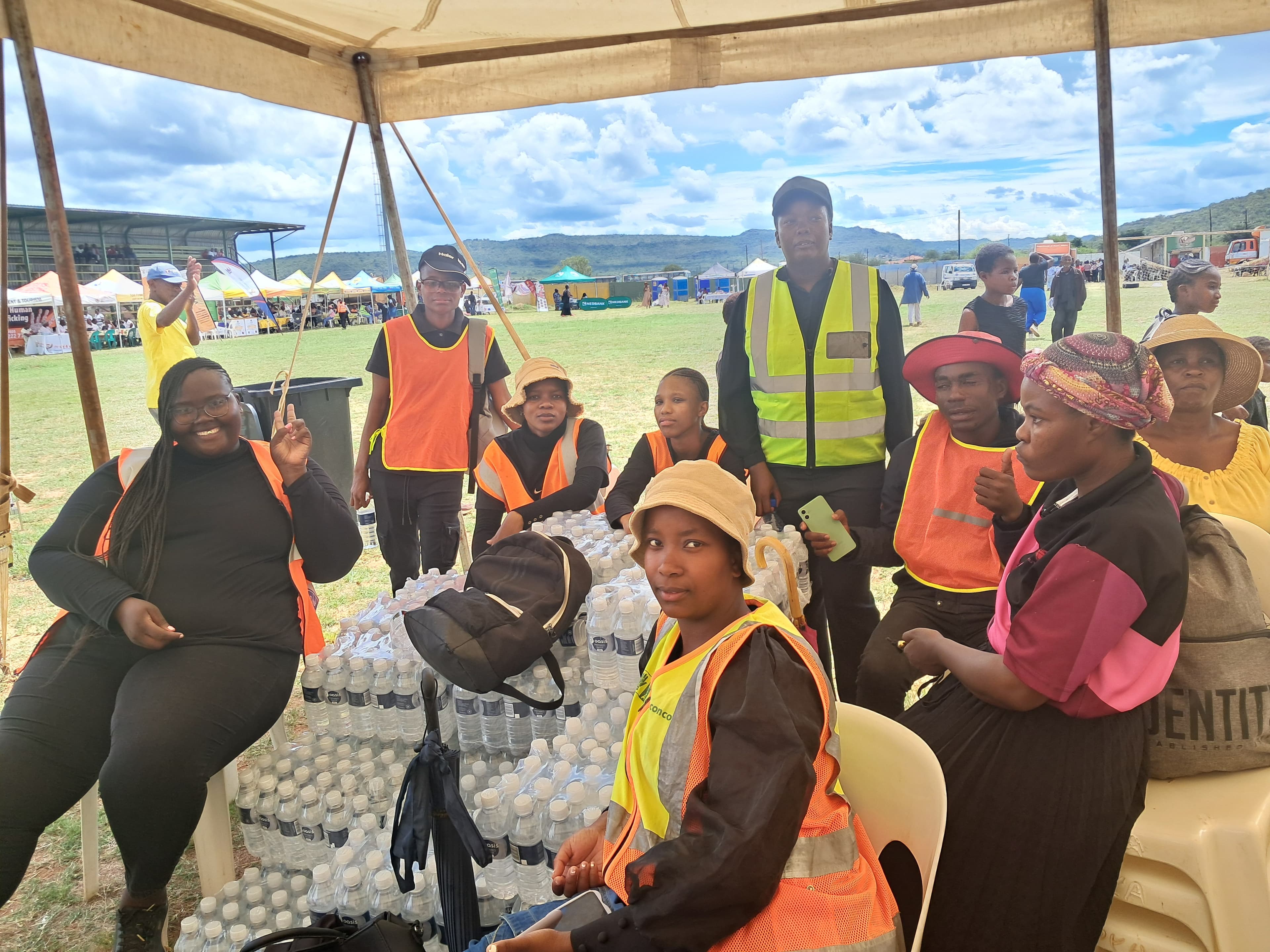 Community members gathered during a SHUTWWEP campaign activation