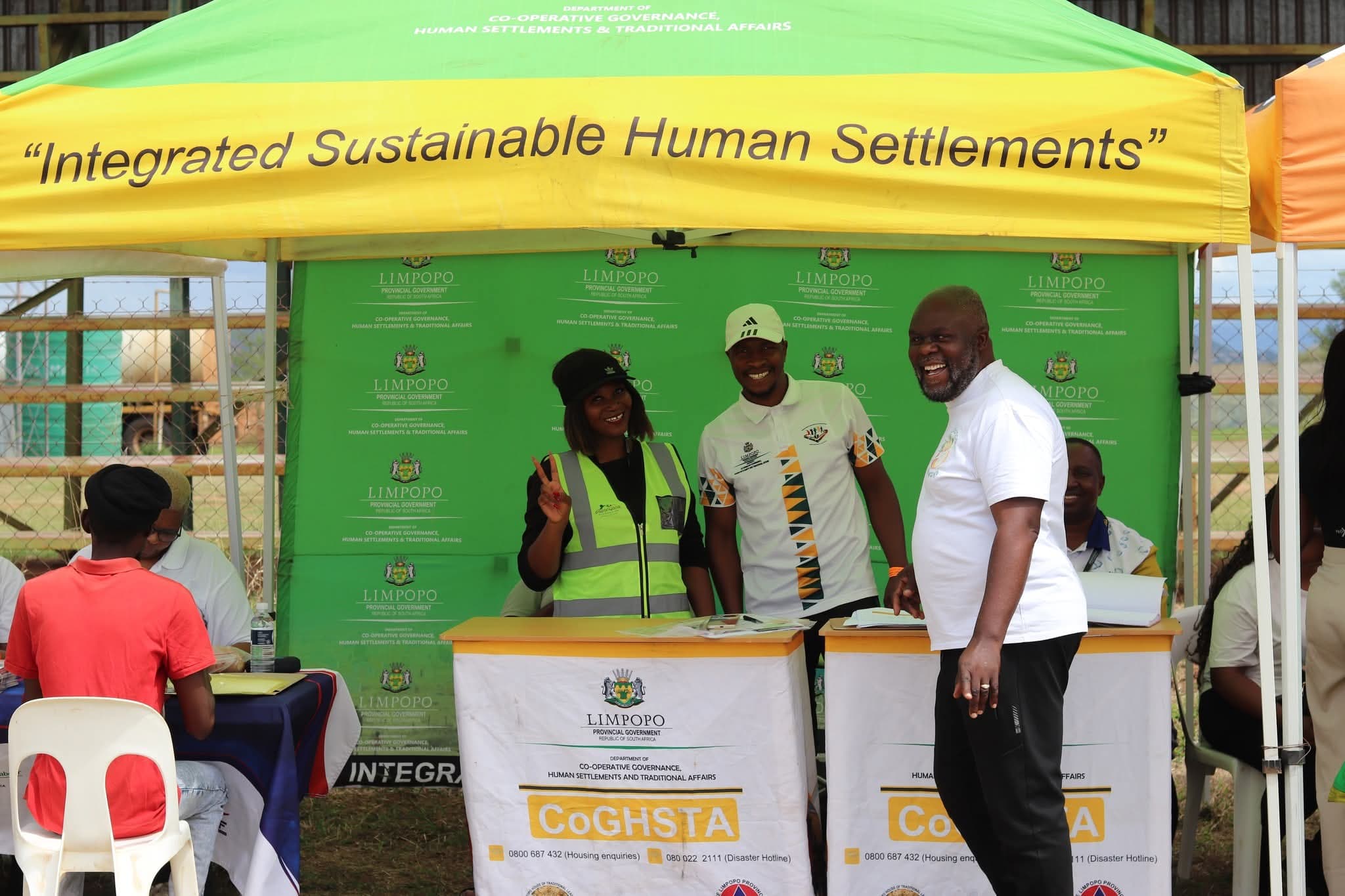 Community members posing together during a campaign engagement