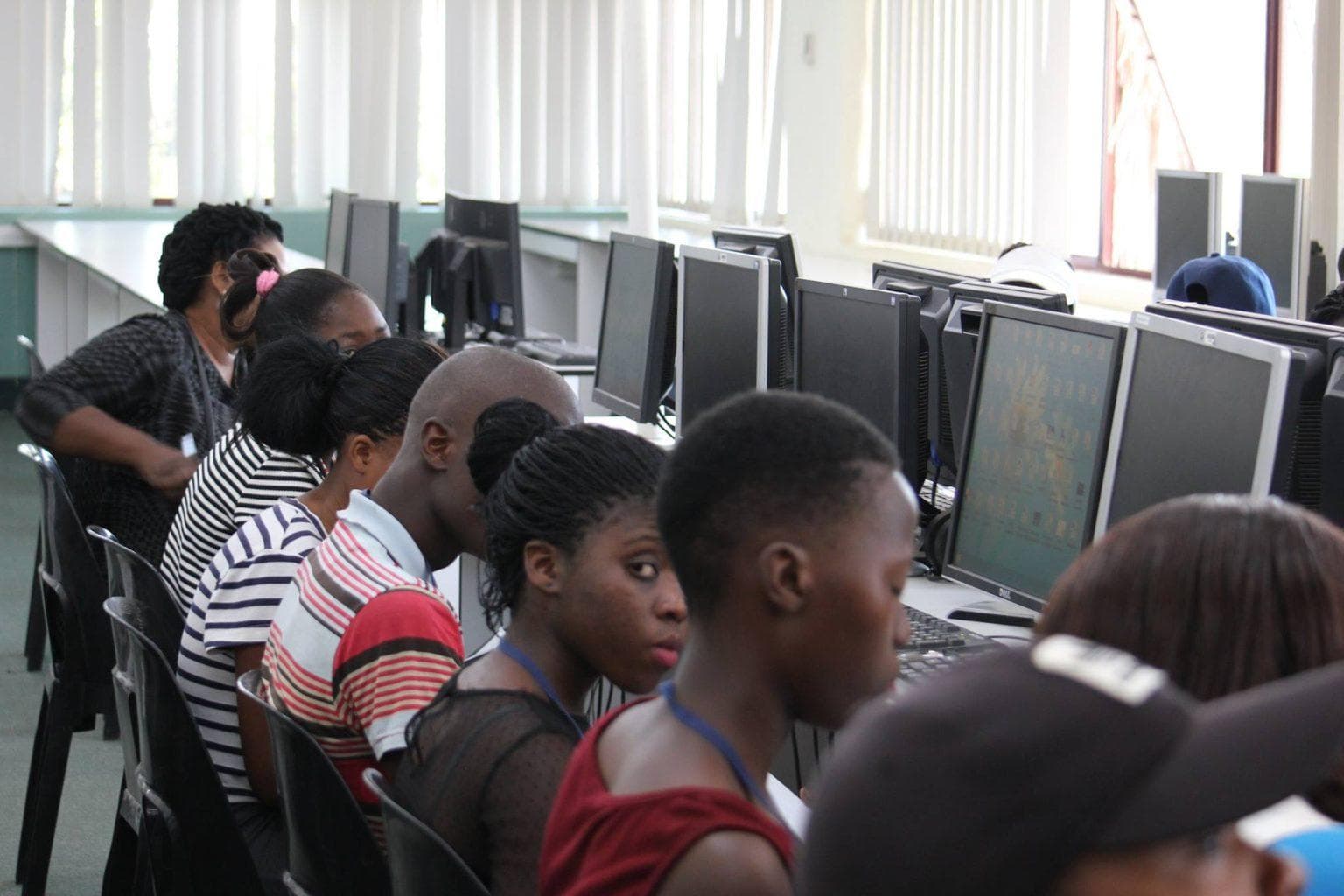 Participants working together during a technology-focused learning session