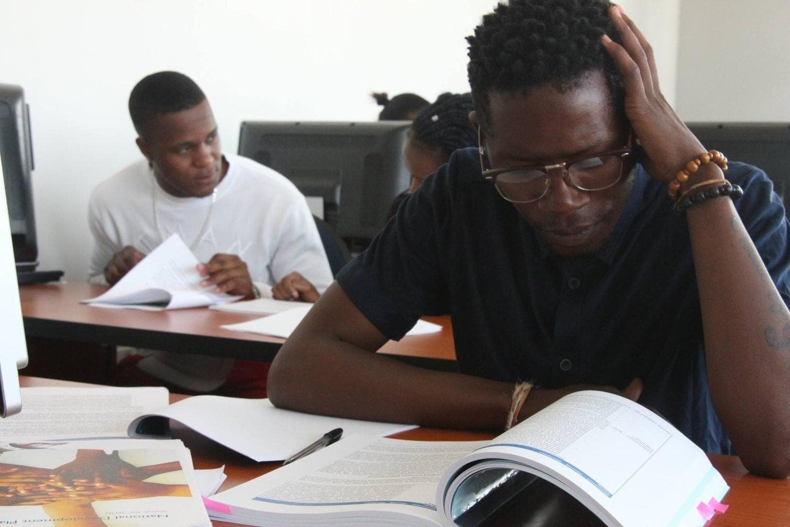 Learners studying in a classroom environment